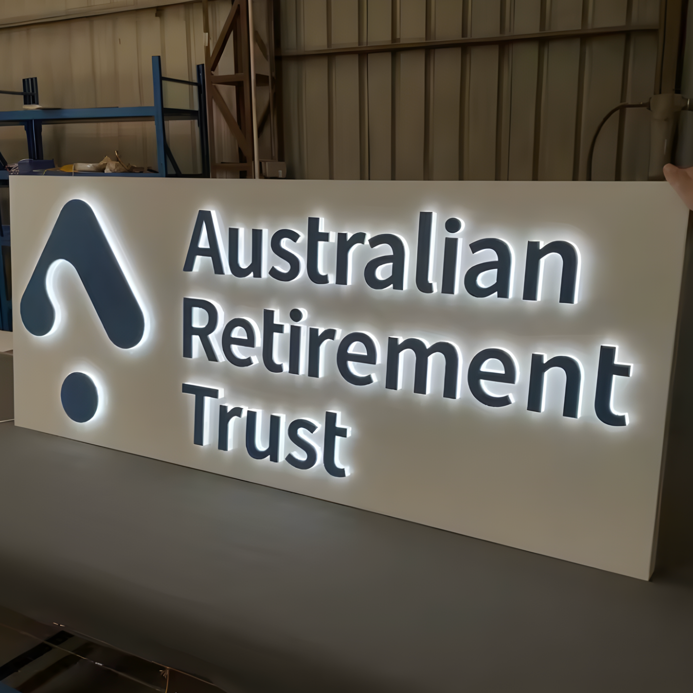 Creative push-through lightbox with lit acrylic logo shapes