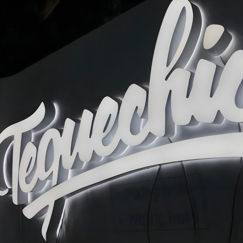 Luxury trimless dual-lit storefront sign with soft halo illumination