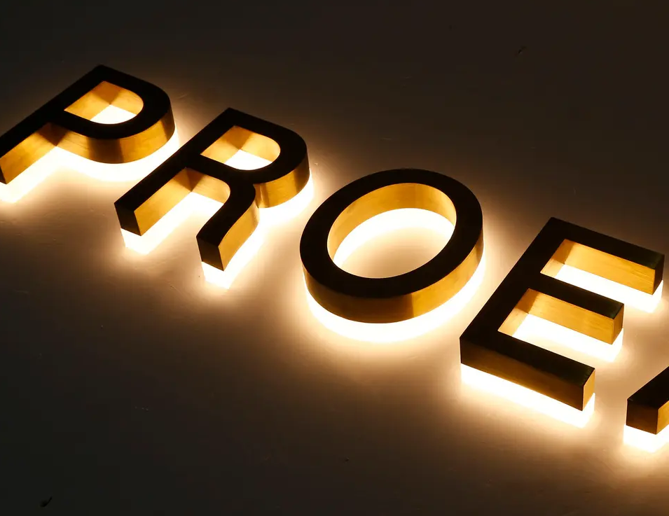 Custom back-lit channel letters for storefront signage with bright LED illumination.
