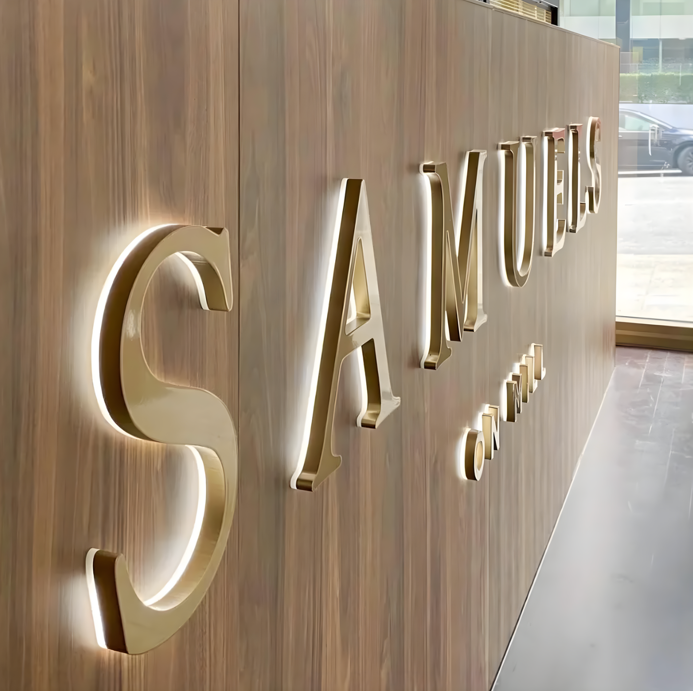 custom business sign halo-lit letters mounted on brick storefront wall