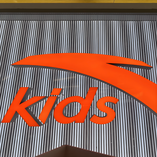 Custom acrylic trimless front-lit LED letters glowing on wall