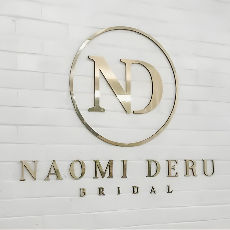 Flat-cut metal sign with precision-cut lettering for storefront branding