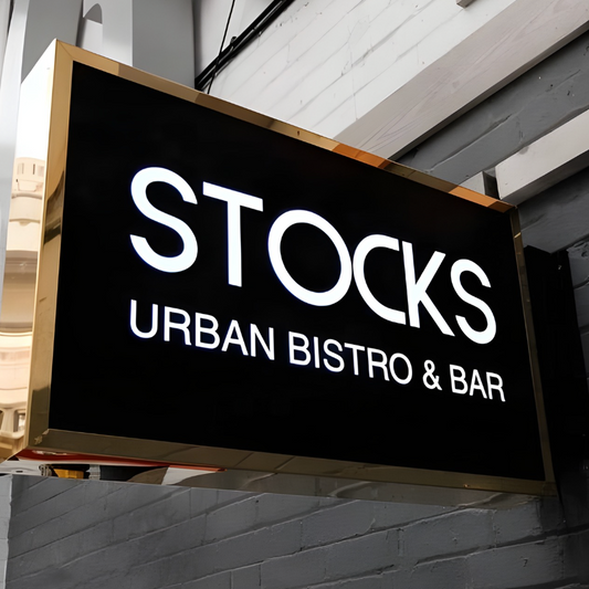 Bold illuminated hollow-out blade sign for retail and restaurants