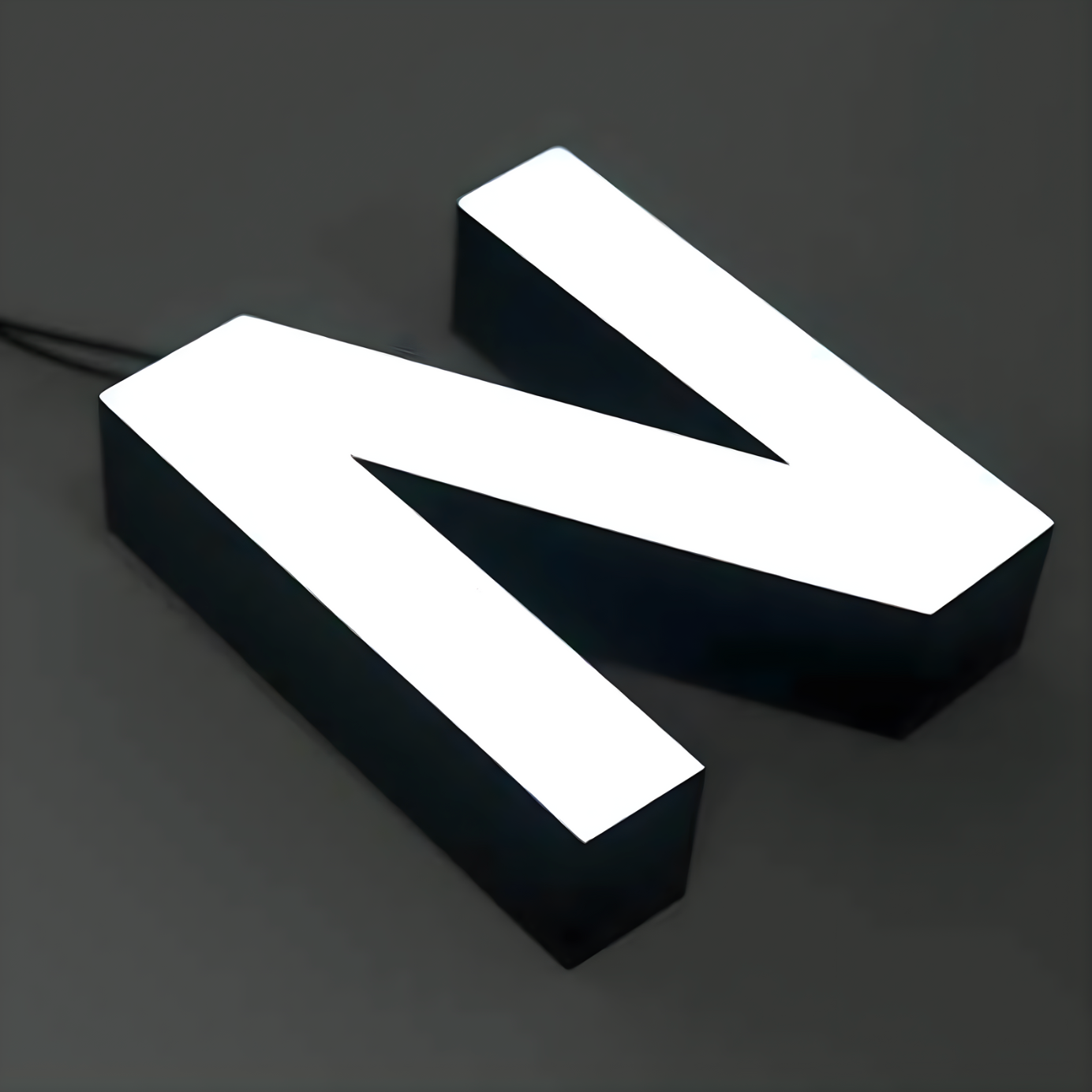 Architectural trimless front-lit channel letters with LED illumination