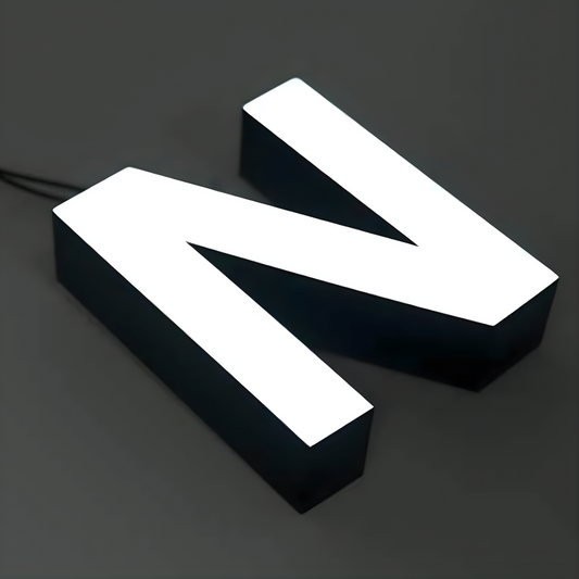 Architectural trimless front-lit channel letters with LED illumination