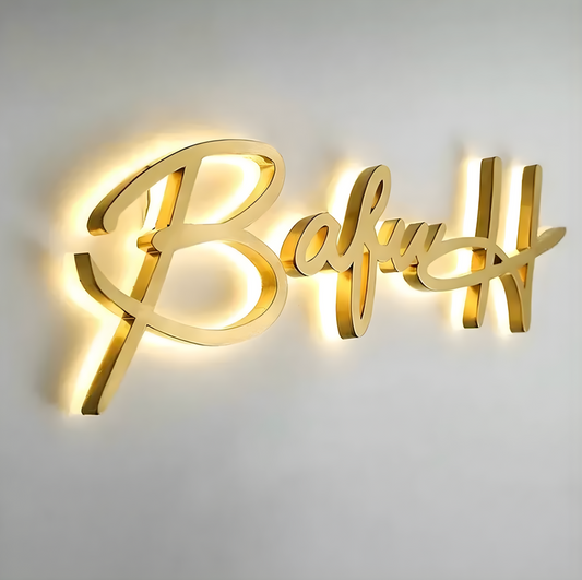 interior lobby sign with reverse-lit stainless letters and soft halo glow