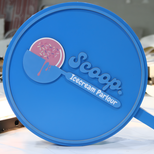 High-contrast push-through blade sign with glowing acrylic elements