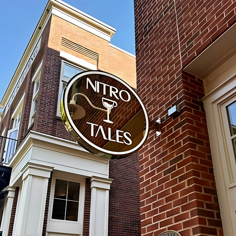 Illuminated push-through blade sign featuring raised acrylic lettering