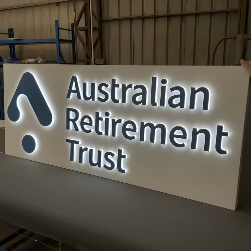 Creative push-through lightbox with lit acrylic logo shapes