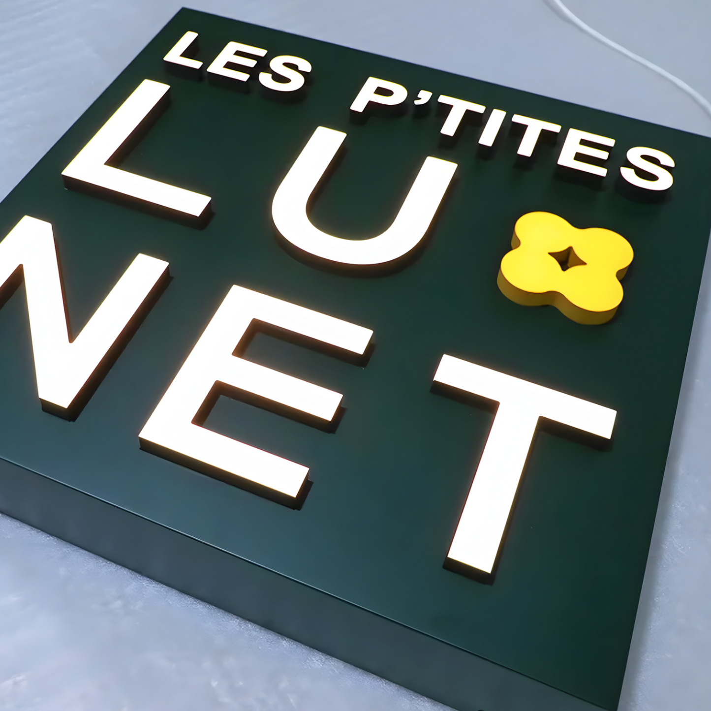 Dimensional acrylic push-through LED logo sign