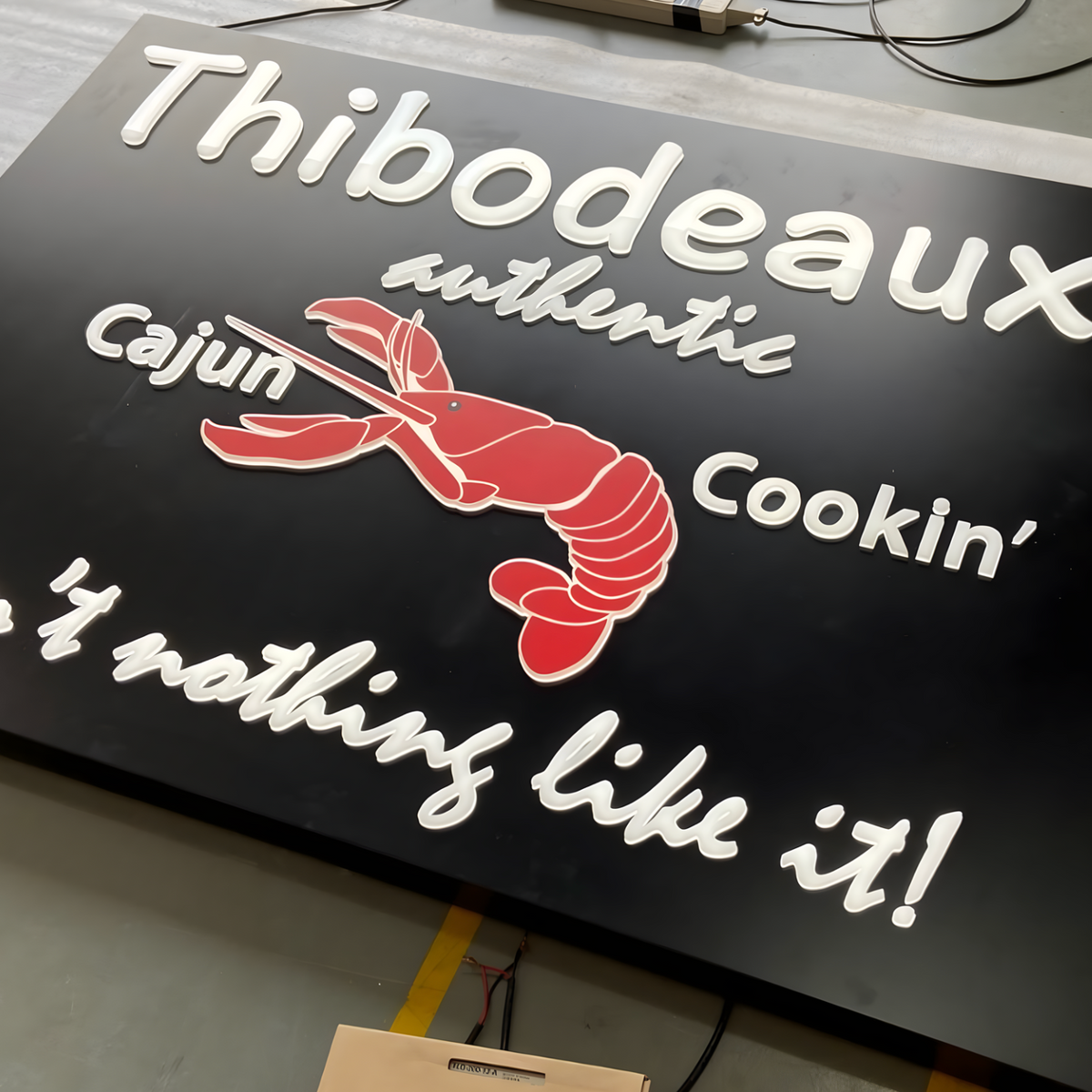 Contemporary push-through lightbox with glowing acrylic inserts