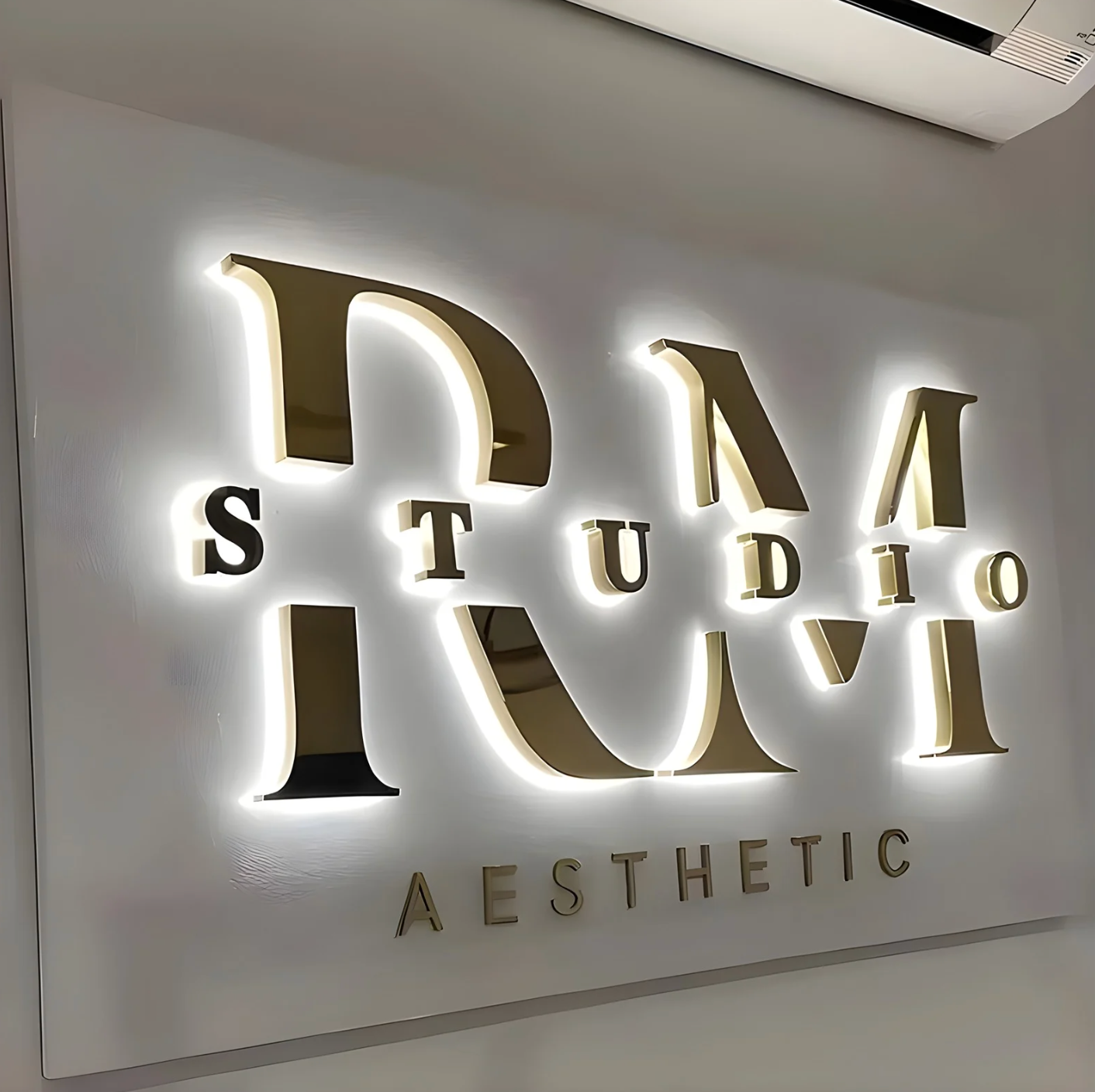 reverse-lit led letters for exterior business sign on retail facade