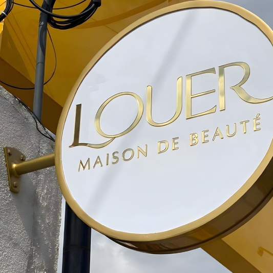 Architectural illuminated trim-cap blade sign with sleek LED design