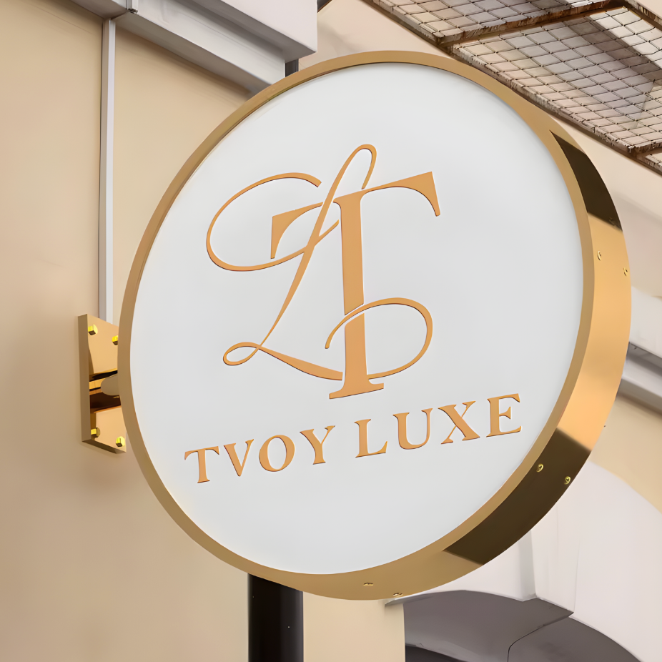 Double-sided illuminated trim-cap blade sign with LED illumination